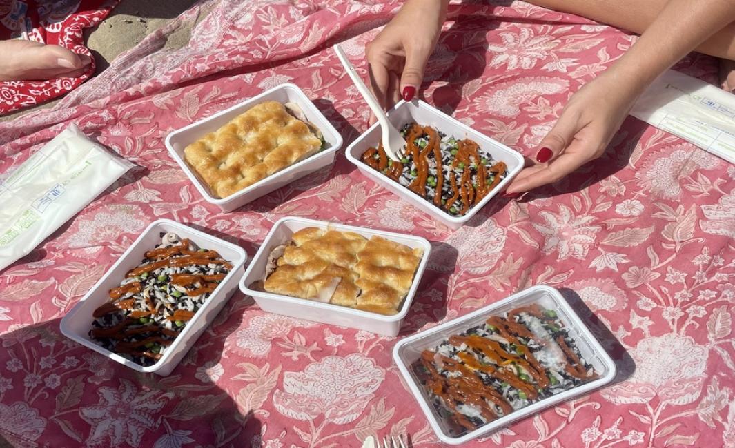 Beach picnic: delicious food, warm sun, relaxation, and company.